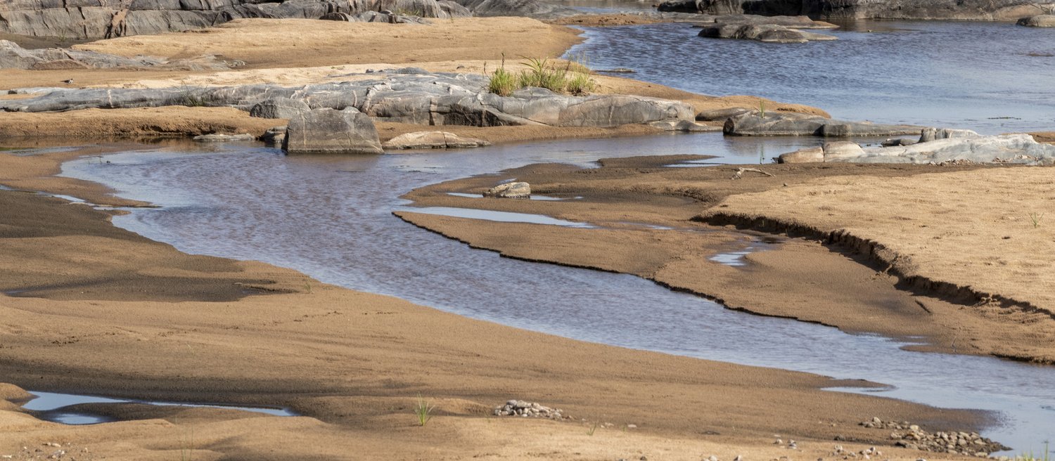 One of the many creeks is sitting on the outbacks of Serengeti National Park.